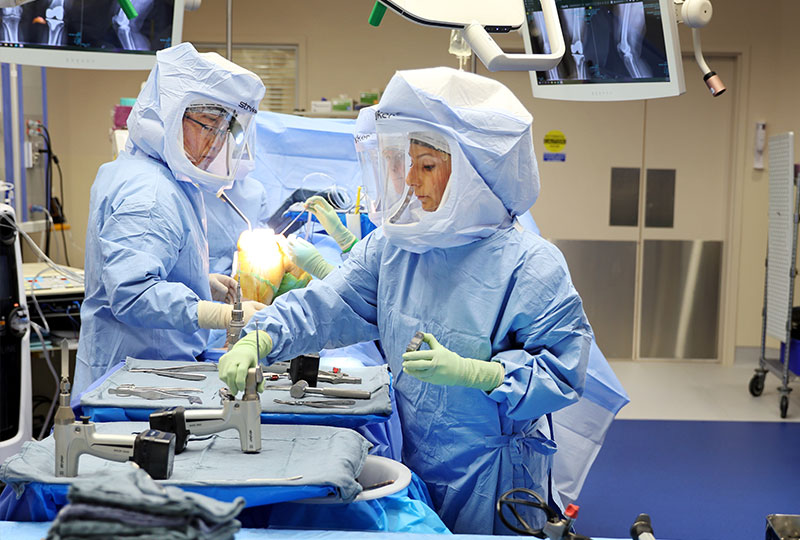 Doctors perform a procedure in the operating room.