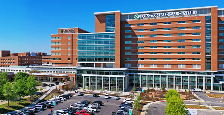 Lexington Medical Center building exterior against a searing blue sky.